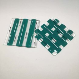 clear, teal coasters with black and white stripes