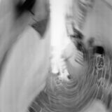 abstract black and white panoramic photographic art of the Steno in Apollonia, Sifnos, Greece, using a swinglens camera and ICM