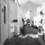 abstract black and white panoramic photographic art of the Steno in Apollonia, Sifnos, Greece, using a swinglens camera and ICM
