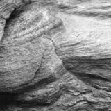 abstract black and white photographic art of rock structures on the island of Sifnos, Greece