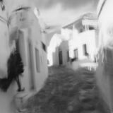 abstract black and white panoramic photographic art of the Steno in Apollonia, Sifnos, Greece, using a swinglens camera and ICM