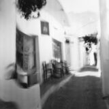 abstract black and white panoramic photographic art of the Steno in Apollonia, Sifnos, Greece, using a swinglens camera and ICM