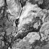 abstract black and white photographic art of rock structures on the island of Sifnos, Greece