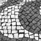 black and white photographic art of cobblestones in Lagos, Portugal