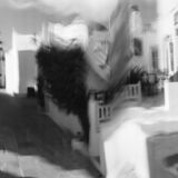 abstract black and white panoramic photographic art of the Steno in Apollonia, Sifnos, Greece, using a swinglens camera and ICM