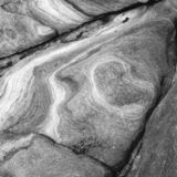 abstract black and white photographic art of rock structures on the island of Sifnos, Greece