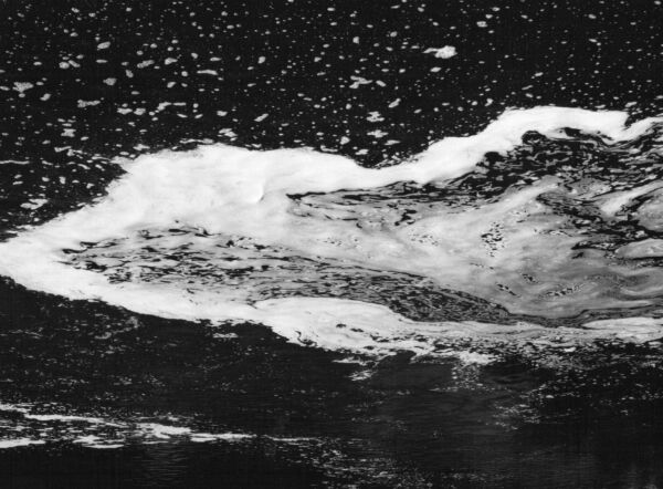 black and white abstract artistic photographs of foam shapes in the Conestoga River at the dam in St. Jacob's, Ontario