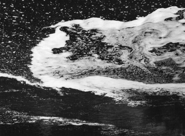 black and white abstract artistic photographs of foam shapes in the Conestoga River at the dam in St. Jacob's, Ontario