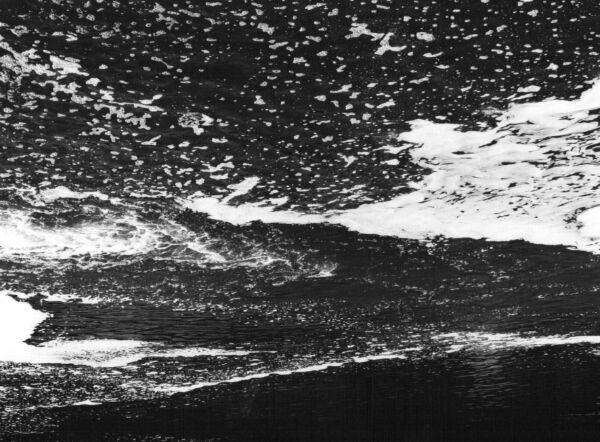 black and white abstract artistic photographs of foam shapes in the Conestoga River at the dam in St. Jacob's, Ontario