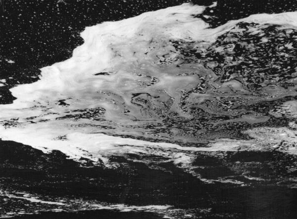 black and white abstract artistic photographs of foam shapes in the Conestoga River at the dam in St. Jacob's, Ontario