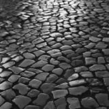 black and white photographic art of cobblestones in Lagos, Portugal