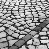 black and white photographic art of cobblestones in Lagos, Portugal