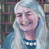 Mary Beard A portrait of historian Mary Beard, smiling, wearing a blue shirt. Behind her is a packed bookcase.