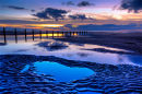 Blackpool, shallow pools in the sand at dusk