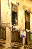 Old man leaning out of window