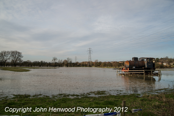 Sunday 23rd December 2012,Blaby, Leicestershire,UK. Flood waters surround Bullseye a steam engine built in 1929 and placed in a field by farmer Peter Thomas when calling for the return of the defunct Blaby Station.