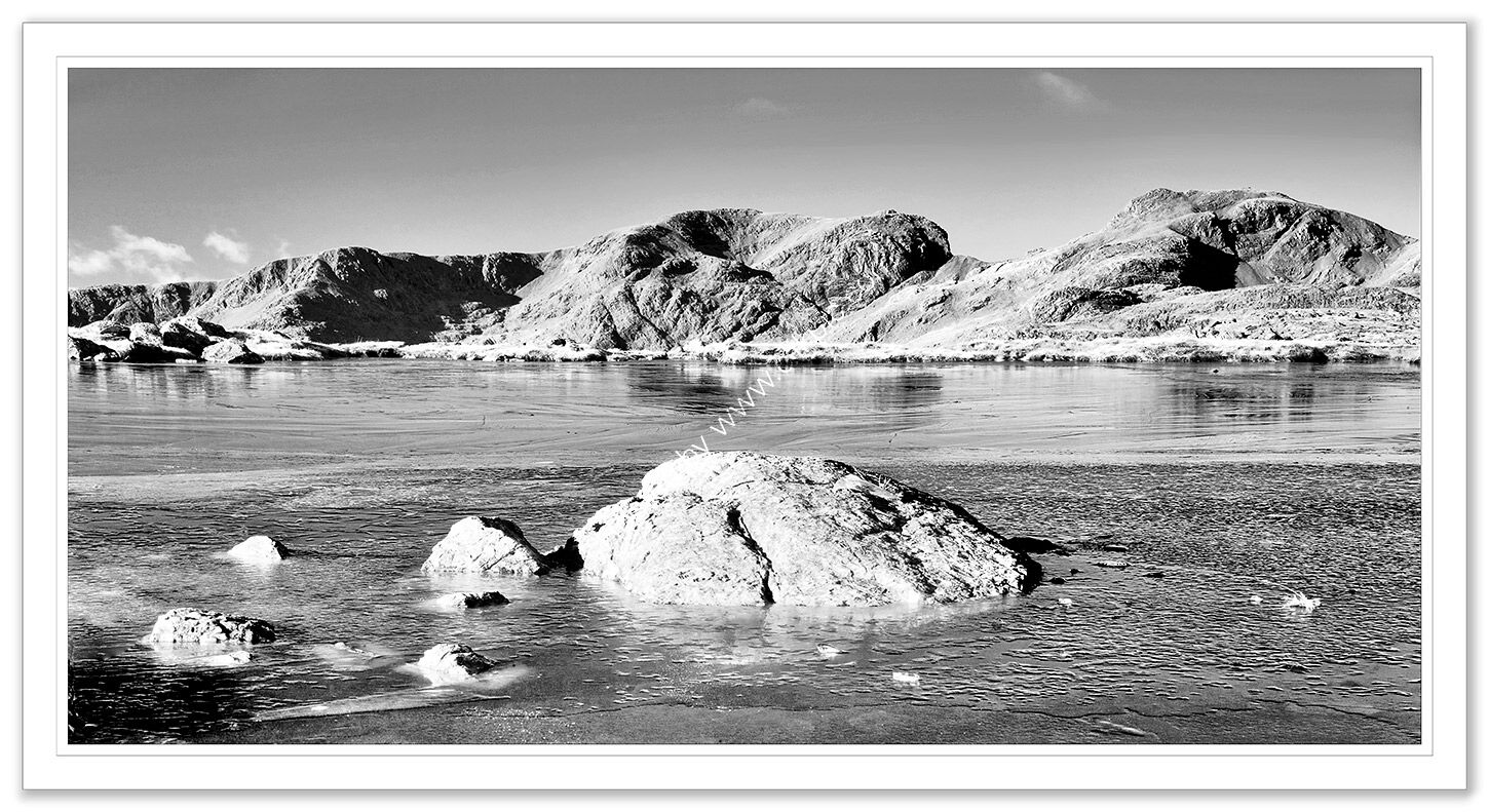 Scafell over a frozen Three Tarns