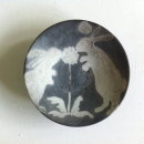 Rabbits sharing dandelion-clock