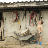 Boy hanging horse harness, roadside campsite, Tipperary, Ireland 2018