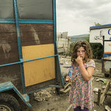 Girl eating sweet, halting site, Tipperary, Ireland 2018