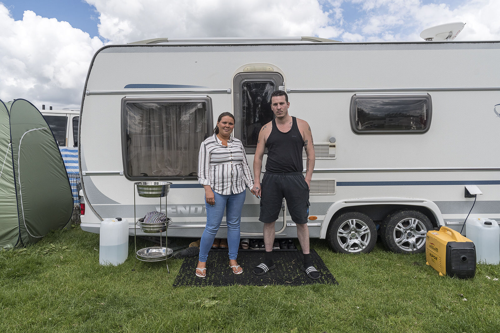 Couple in front of their Caravan, Appleby Horse Fair, UK 2019