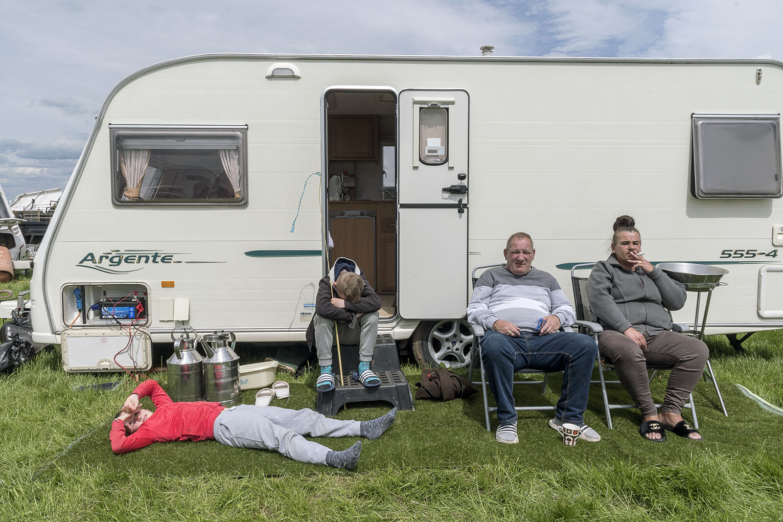 Family on Artificial Grass, Appleby Horse Fair, UK 2019