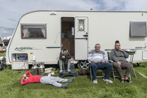 Family on Artificial Grass, Appleby Horse Fair, UK 2019