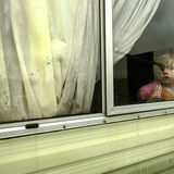 Girl in window, roadside campsite, Tipperary, Ireland 2018