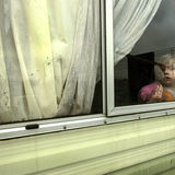 Girl at window on New Year's Day, roadside campsite, Tipperary, Ireland 2019