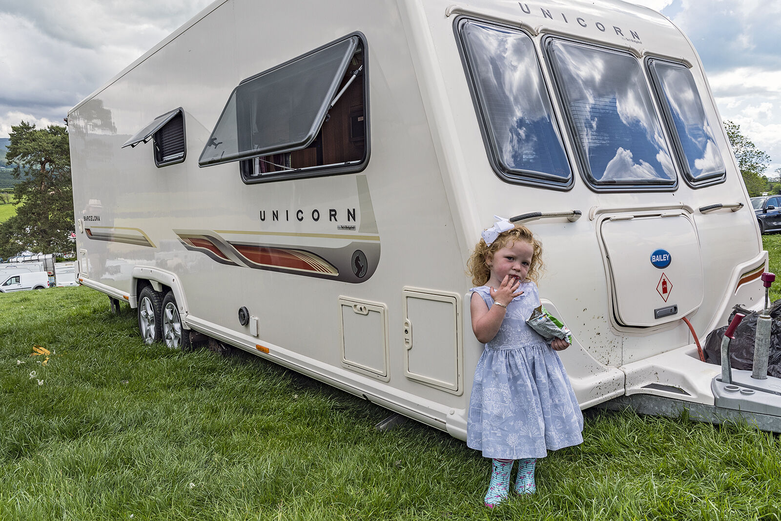 Girl Eating Snack, Appleby, UK 2019