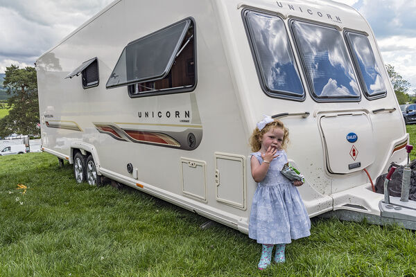 Girl Eating Snack, Appleby, UK 2019