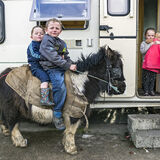 Michael and Pa on pony and Nikita with doll, roadside campsite, Tipperary, Ireland 2019