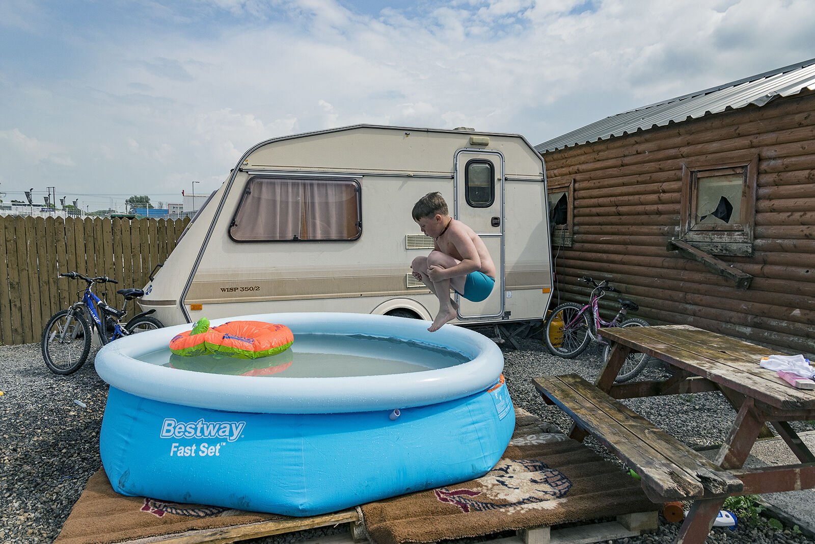 Mikey jumps into the pool during a rare heatwave, Limerick, Ireland 2018