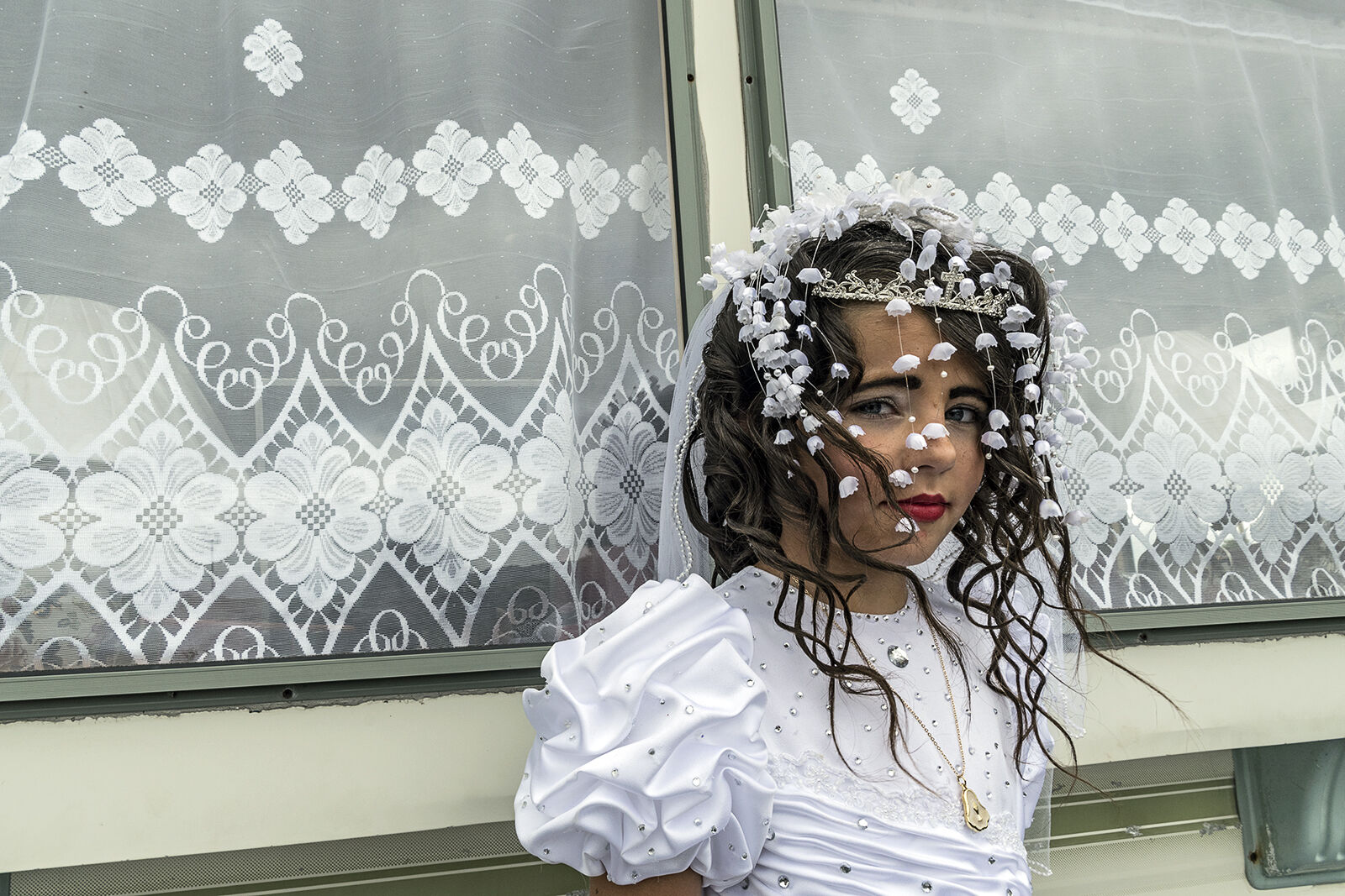 Nikita outside family's caravan on her first holy communion, Tipperary, Ireland 2019