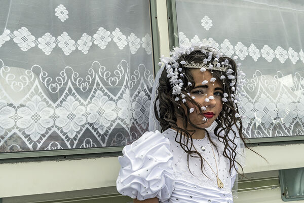 Nikita outside family's caravan on her first holy communion, Tipperary, Ireland 2019