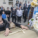 Wife at her late husband's coffin, Limerick, Ireland 2019