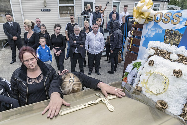 Wife at her late husband's coffin, Limerick, Ireland 2019