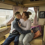 William and Pricilla kissing in their caravan, roadside campsite, Tipperary, Ireland 2018