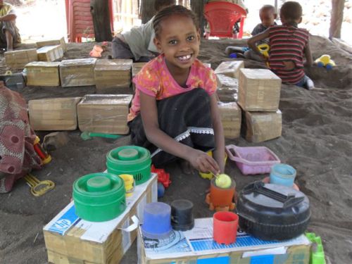 preparing 'lunch' in the sandpit