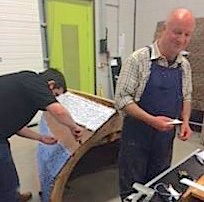 Dave and James glueing on finished "planks"