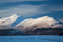 Snow covered Catbells across a frozen Derwent Water