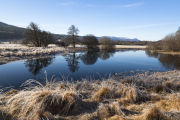 Reflections in the still water of River Moriston, Glen Moriston