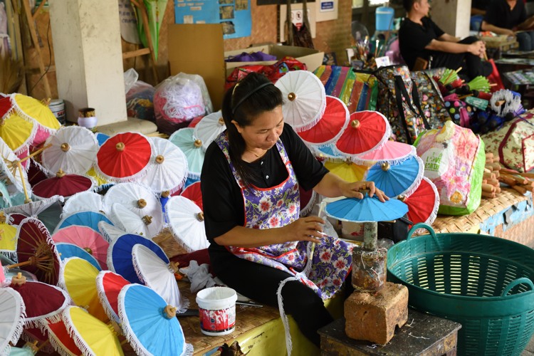 Woman working at the Umbrella Making Centre