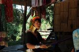 Young Kayan Lahwi woman working at a loom