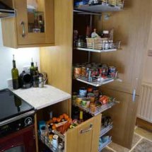 Storage solutions being installed Pull-out Sections installed by kitchens insynk ltd