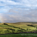 Coverdale in late evening light with the end of a rainbow