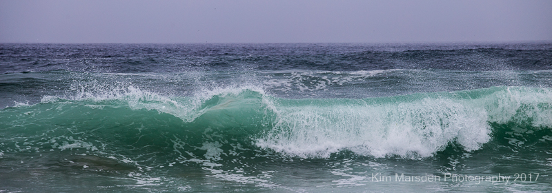 Beautifully lit waves on Bamburgh beach