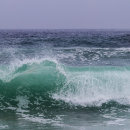 Beautifully lit waves on Bamburgh beach