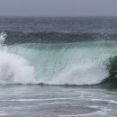 Beautifully lit waves on Bamburgh beach
