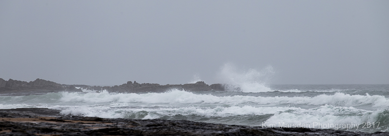 Waves crashing on Bamburgh beach